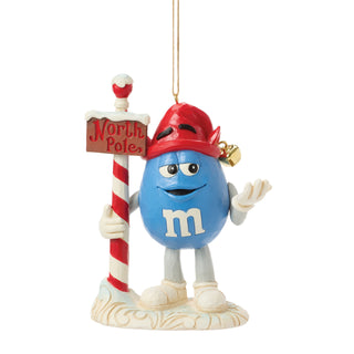 Jim Shore M&M's: Blue M&M With Strand by North Pole Sign Hanging Ornament sparkle-castle