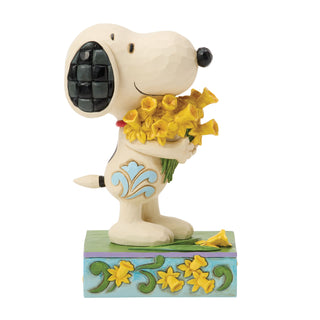 Jim Shore Peanuts: Snoopy With Bouquet of Daffodils Figurine sparkle-castle