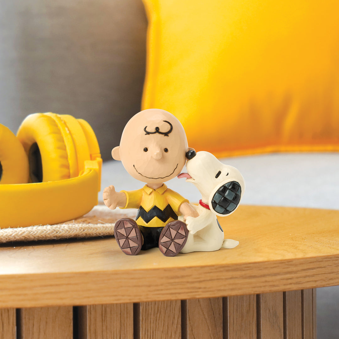 Jim Shore Peanuts: Snoopy Licking Charlie Brown's Cheek Figurine sparkle-castle