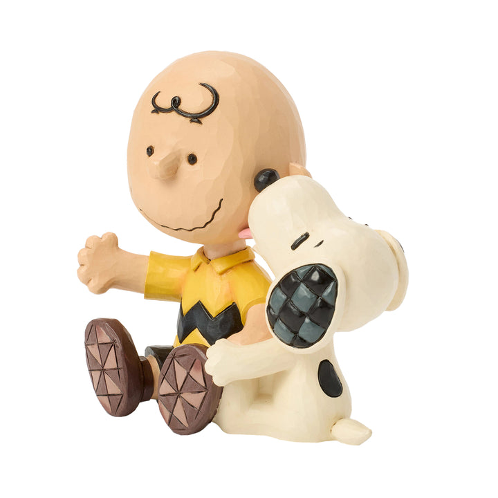 Jim Shore Peanuts: Snoopy Licking Charlie Brown's Cheek Figurine sparkle-castle