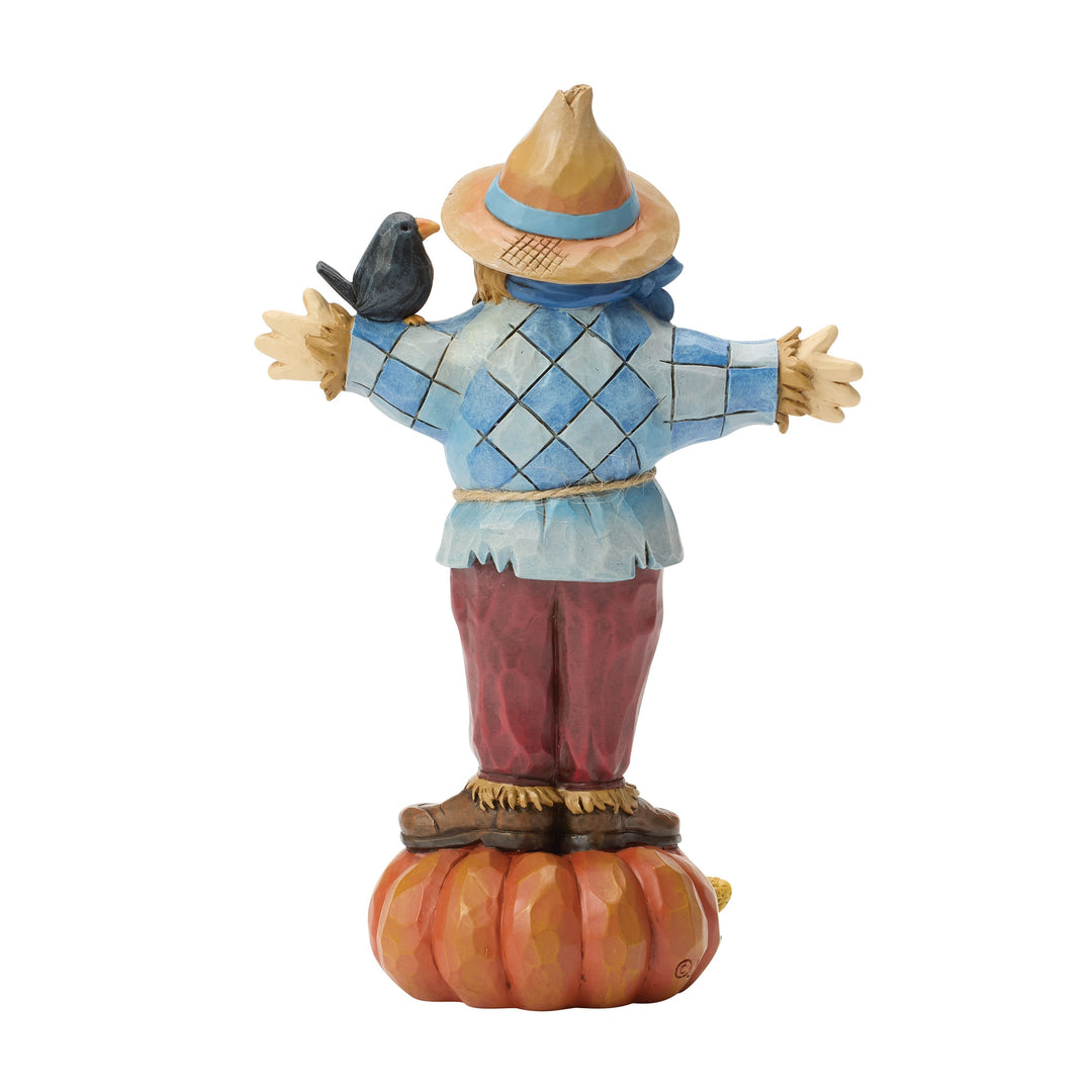 Jim Shore Heartwood Creek: Scarecrow Standing on Pumpkin Figurine sparkle-castle