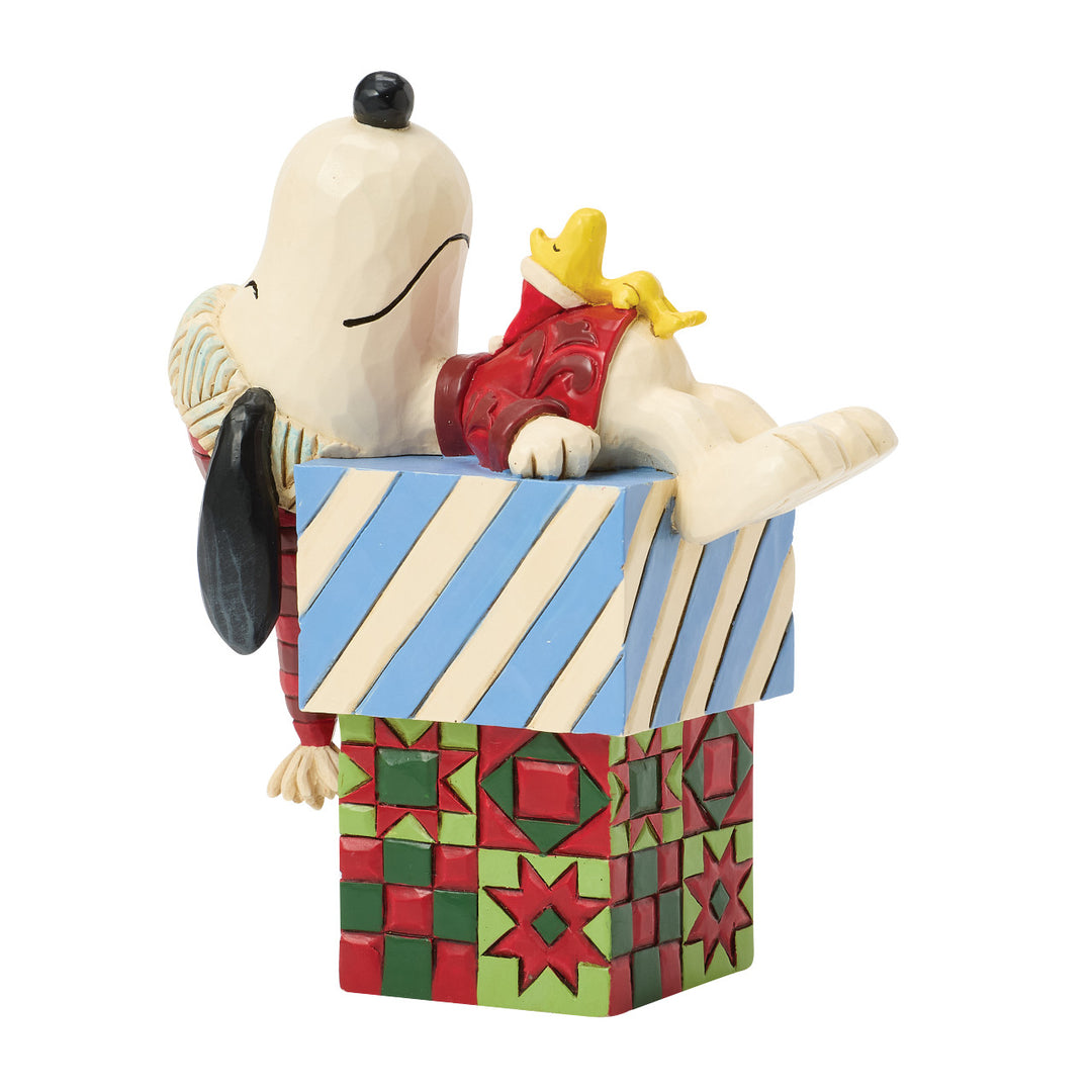 Jim Shore Peanuts: Snoopy & Woodstock Laying On Gifts Figurine sparkle-castle