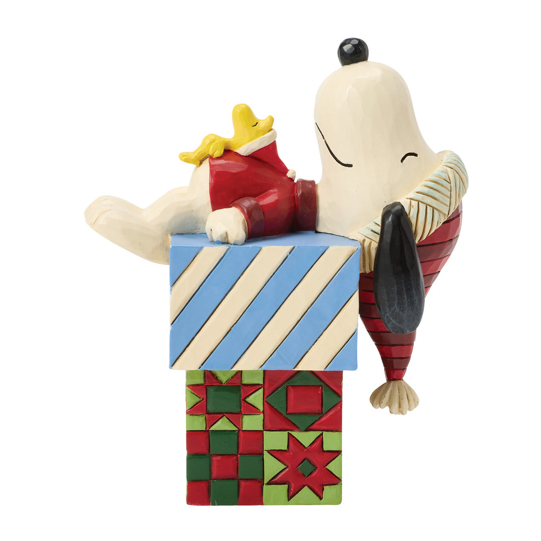 Jim Shore Peanuts: Snoopy & Woodstock Laying On Gifts Figurine sparkle-castle