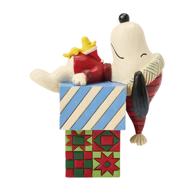 Jim Shore Peanuts: Snoopy & Woodstock Laying On Gifts Figurine sparkle-castle