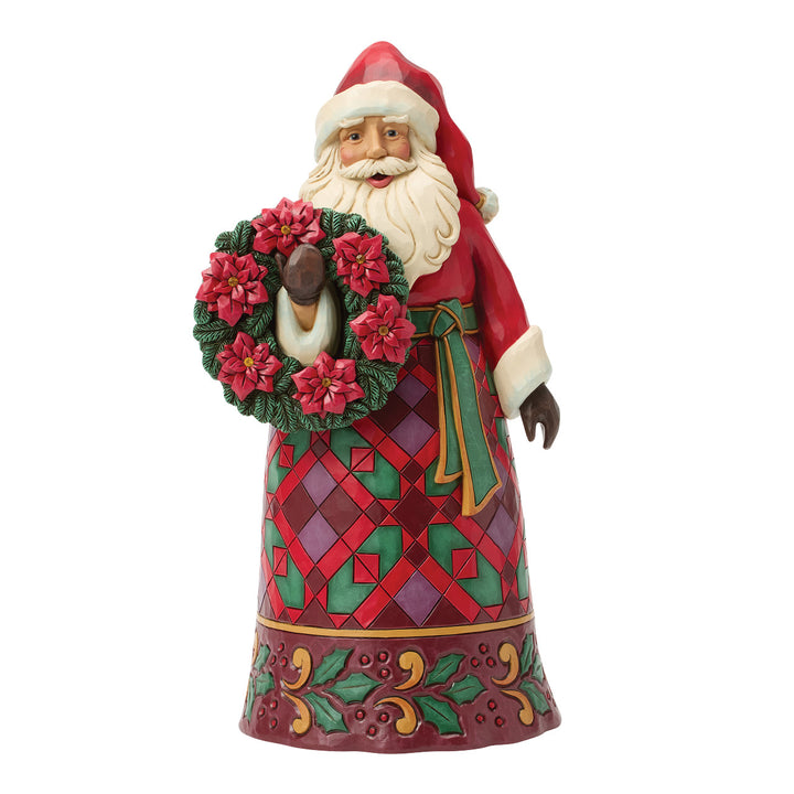 Jim Shore Heartwood Creek: Santa Holding Poinsettia Wreath Figurine sparkle-castle