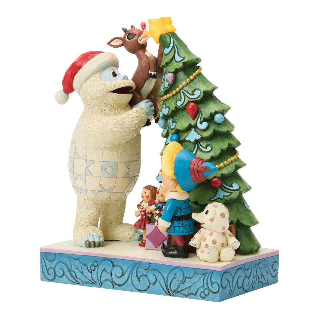 Jim Shore Rudolph Traditions: Bumble Holding Rudolph by Tree Figurine sparkle-castle