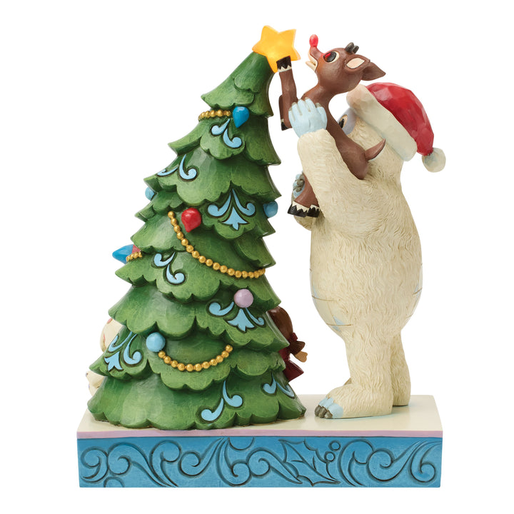 Jim Shore Rudolph Traditions: Bumble Holding Rudolph by Tree Figurine sparkle-castle
