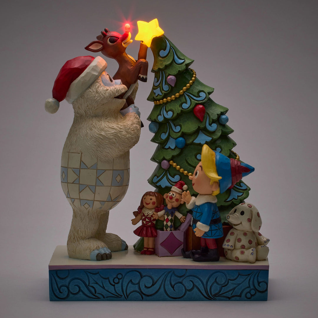 Jim Shore Rudolph Traditions: Bumble Holding Rudolph by Tree Figurine sparkle-castle