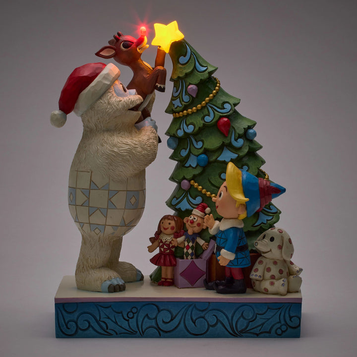 Jim Shore Rudolph Traditions: Bumble Holding Rudolph by Tree Figurine sparkle-castle