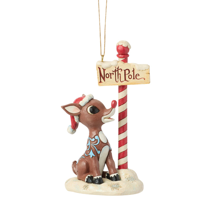 Jim Shore Rudolph Traditions: Rudolph by North Pole Sign Hanging Ornament sparkle-castle