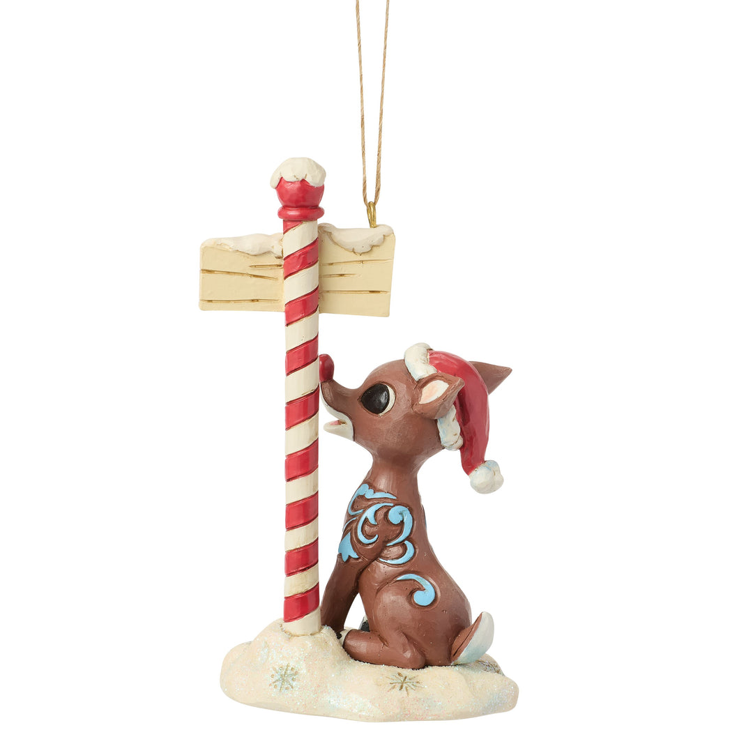 Jim Shore Rudolph Traditions: Rudolph by North Pole Sign Hanging Ornament sparkle-castle