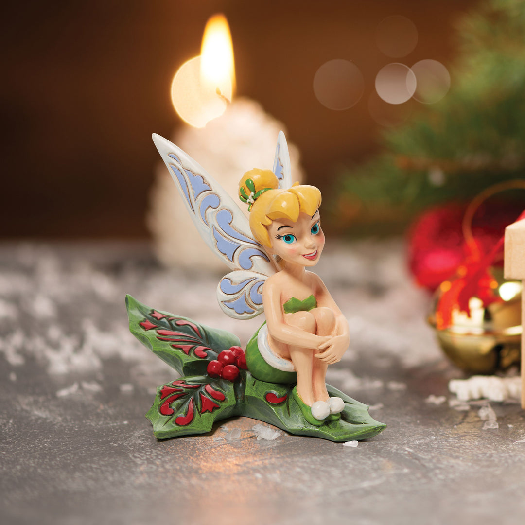 Jim Shore Disney Traditions: Tinker Bell Sitting on Holly Figurine sparkle-castle