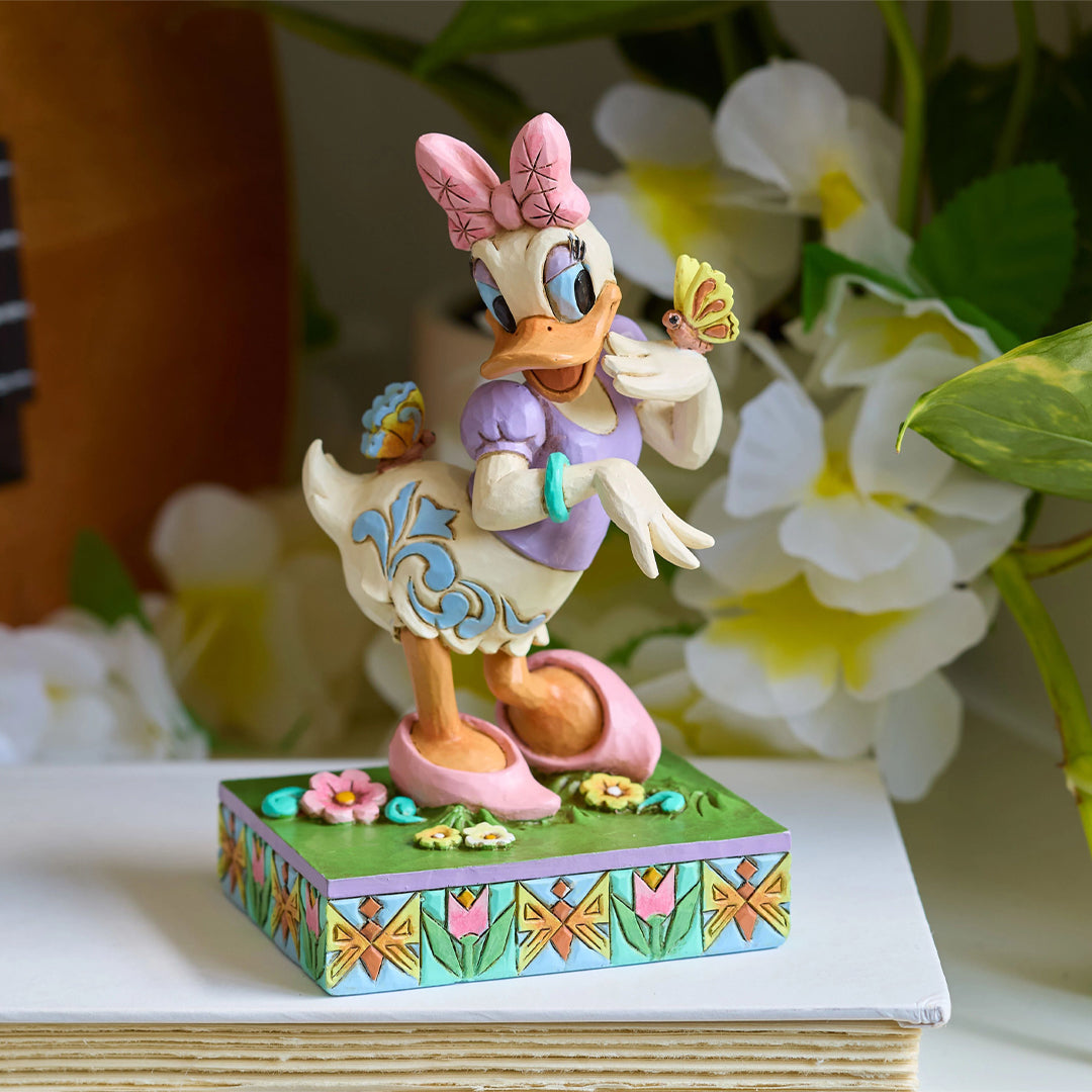 Jim Shore Disney Traditions: Daisy Duck With Butterflies Figurine sparkle-castle