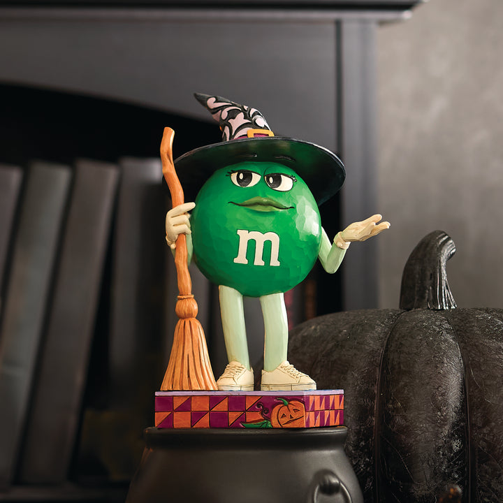 Jim Shore M&M'S: Green M&M Witch With Broom Figurine sparkle-castle