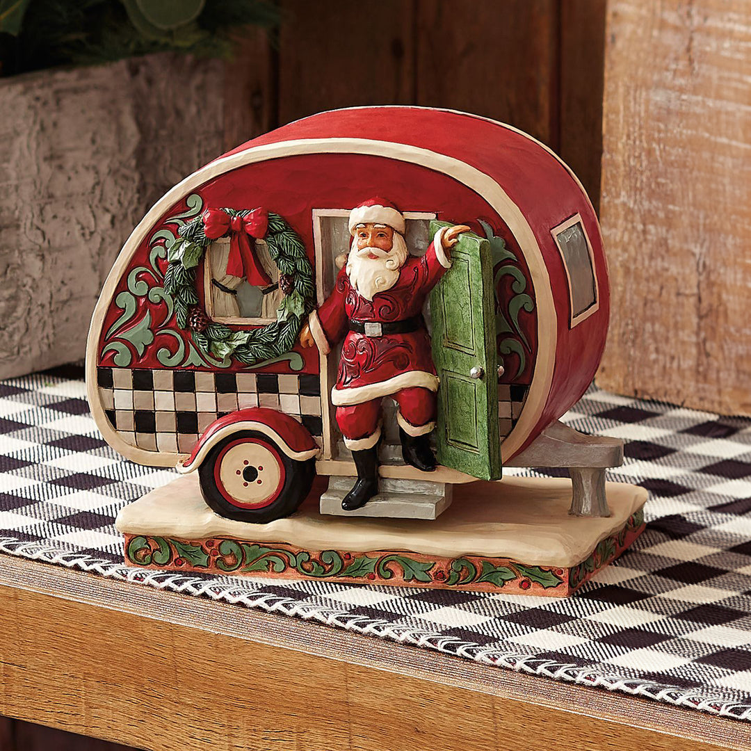 Jim Shore Heartwood Creek: Highland Glen Santa in Plaid Camper Figurine sparkle-castle