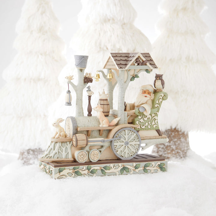 Jim Shore Heartwood Creek: White Woodland Santa and Train Engine Figurine sparkle-castle