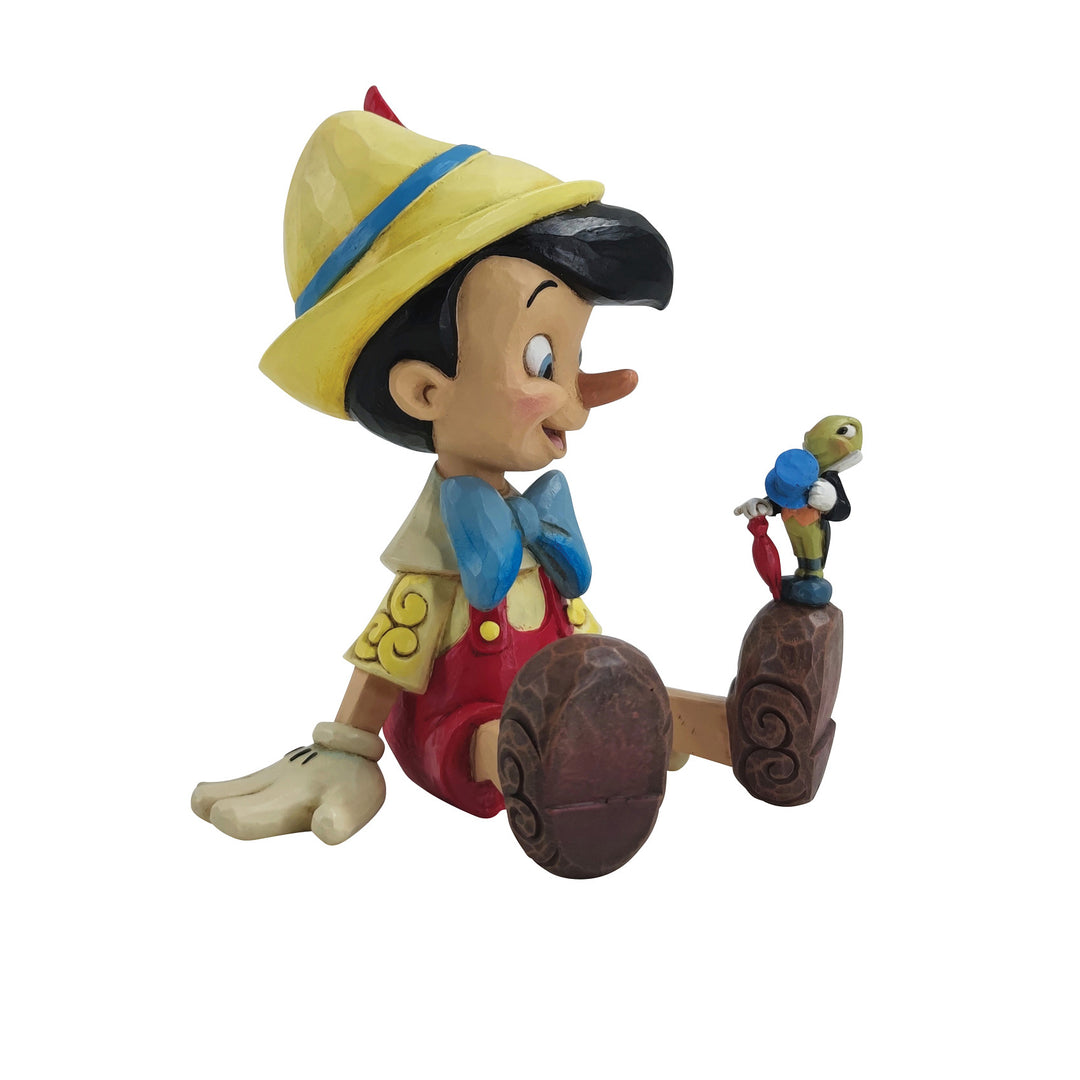 Jim Shore Disney Traditions: Pinocchio & Jiminy Sitting Figurine sparkle-castle