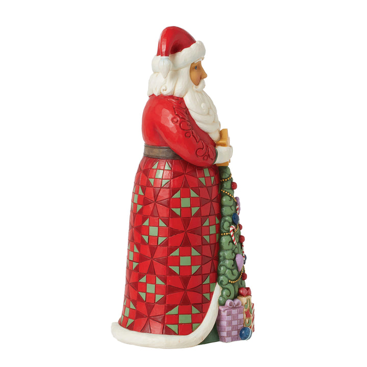 Jim Shore Heartwood Creek: Santa with Christmas Tree Coat Figurine sparkle-castle