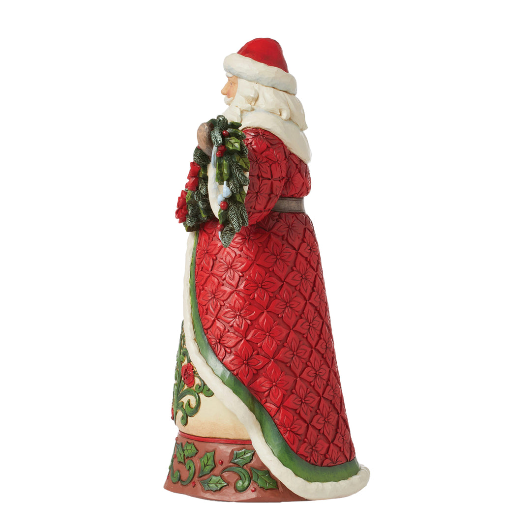 Jim Shore Heartwood Creek: Santa With Poinsettia Garland Figurine sparkle-castle