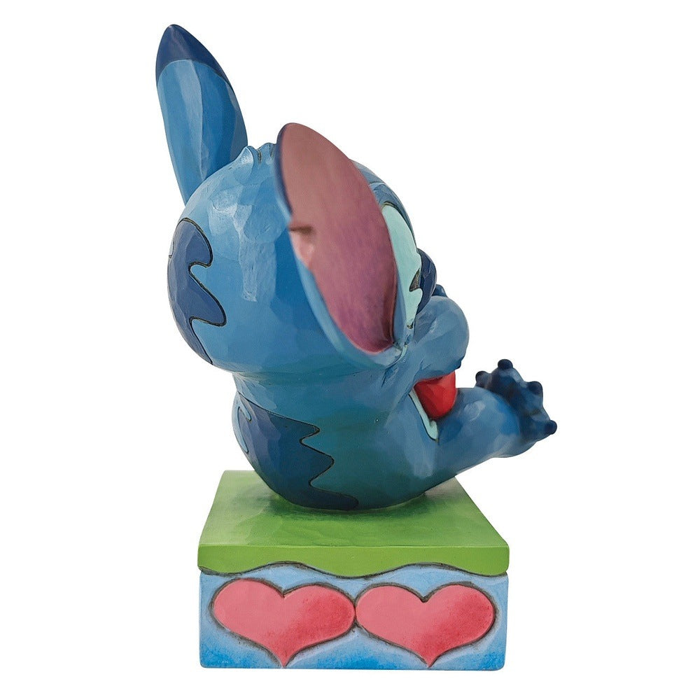 Jim Shore Disney Traditions: Stitch Hugging Heart Figurine sparkle-castle