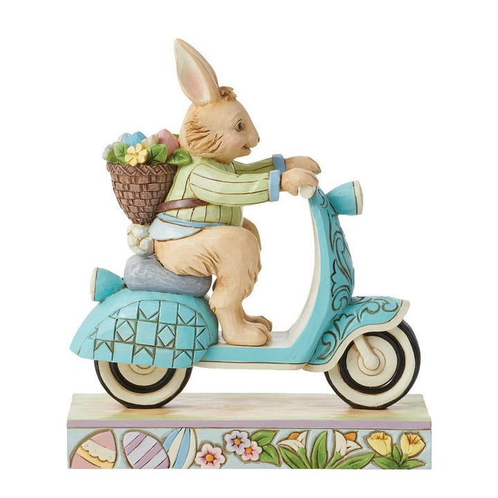 Jim Shore Heartwood Creek: Easter Bunny Riding Scooter Figurine sparkle-castle