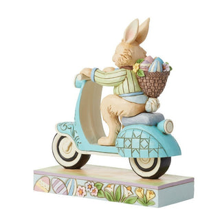 Jim Shore Heartwood Creek: Easter Bunny Riding Scooter Figurine sparkle-castle
