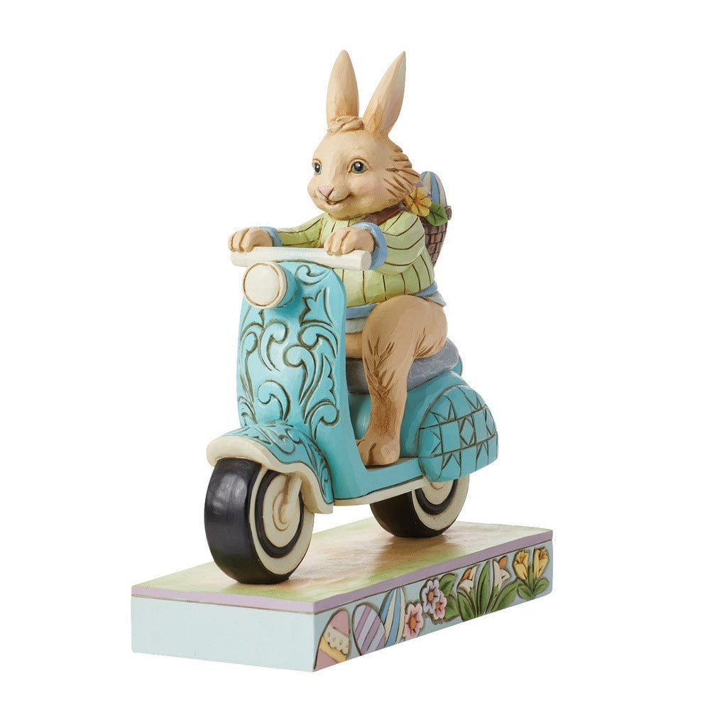 Jim Shore Heartwood Creek: Easter Bunny Riding Scooter Figurine sparkle-castle