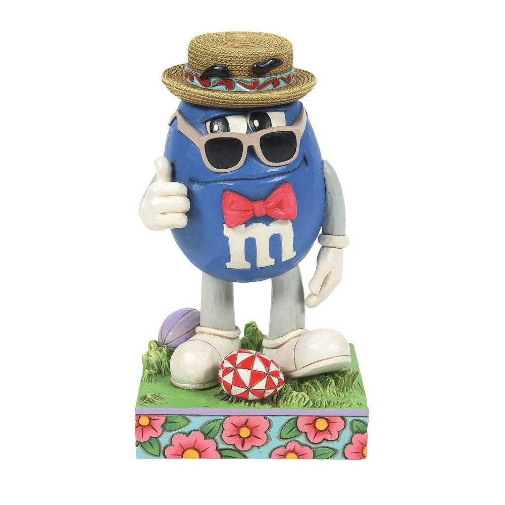 Jim Shore M&M'S: Blue M&M Wearing Easter Hat, Sunglasses and Bowtie Figurine sparkle-castle