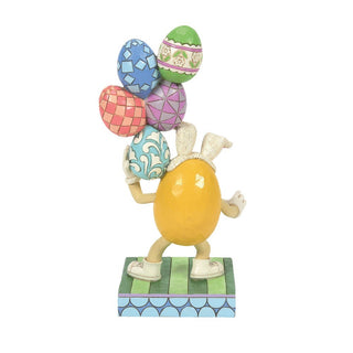 Jim Shore M&M'S: Yellow Easter M&M With Stacked Eggs Figurine sparkle-castle