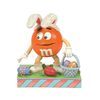 Jim Shore M&M'S: Orange M&M On Easter Egg Hunt Figurine sparkle-castle