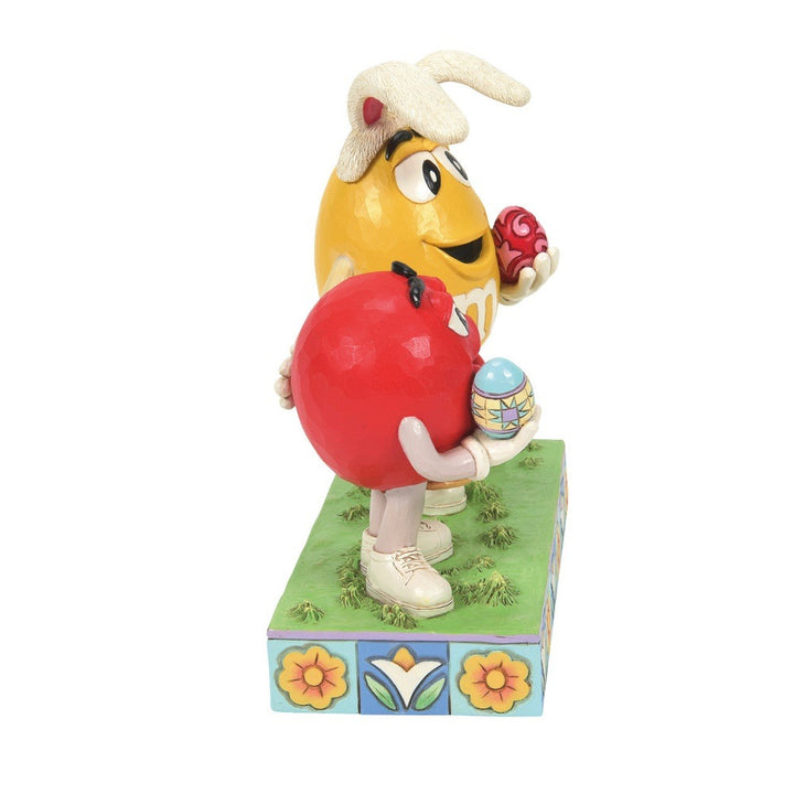 Jim Shore M&M'S: Red & Yellow M&M With Easter Basket & Eggs Figurine sparkle-castle
