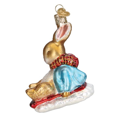 Old World Christmas: Peter Rabbit On Sled Hanging Ornament sparkle-castle