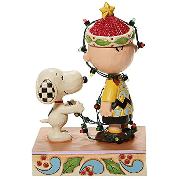 Jim Shore Peanuts: Charlie Brown Tangled Lights Figurine sparkle-castle