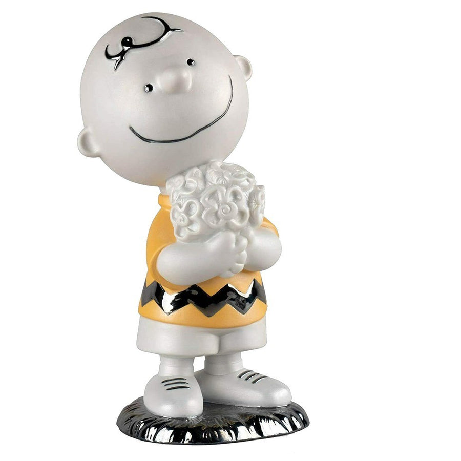 Lladró Peanuts Collection: Charlie Brown Holding Bouquet Flowers Figurine sparkle-castle