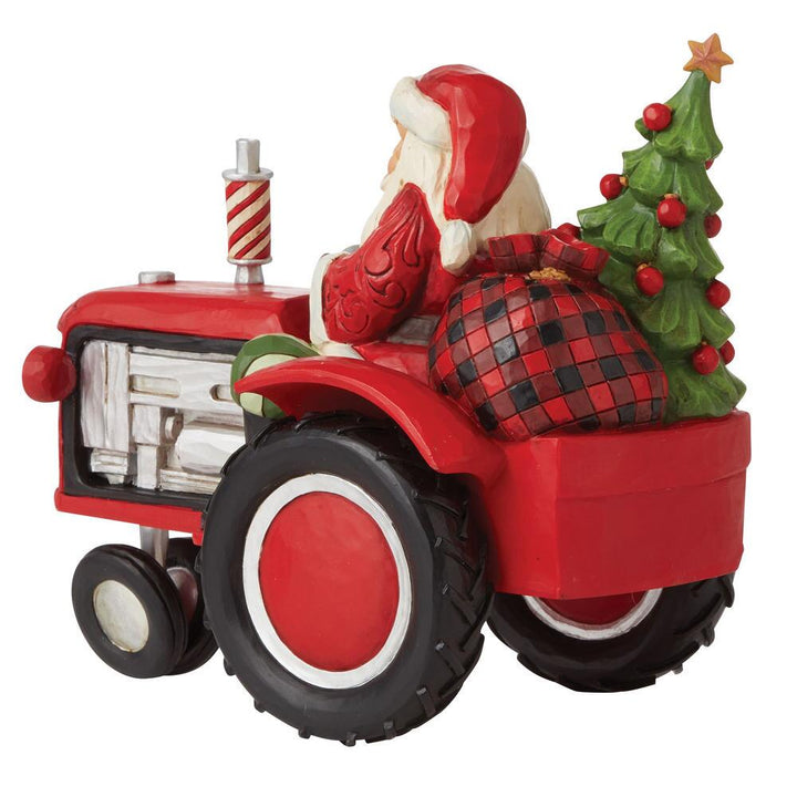 Jim Shore Country Living: Santa Driving Tractor Figurine sparkle-castle