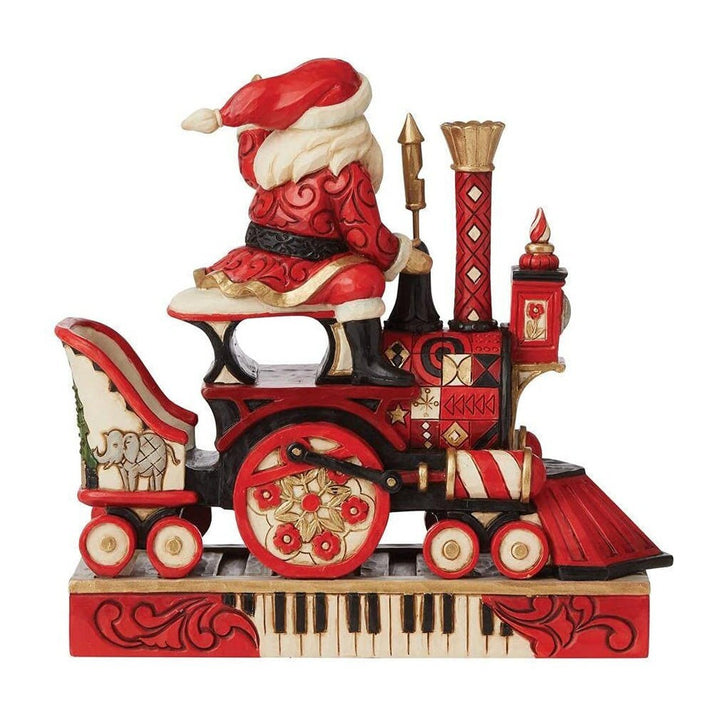 Jim Shore FAO Schwarz: Santa Riding Train Figurine sparkle-castle