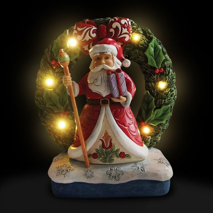 Jim Shore Heartwood Creek: Santa by Light Up Wreath Figurine sparkle-castle
