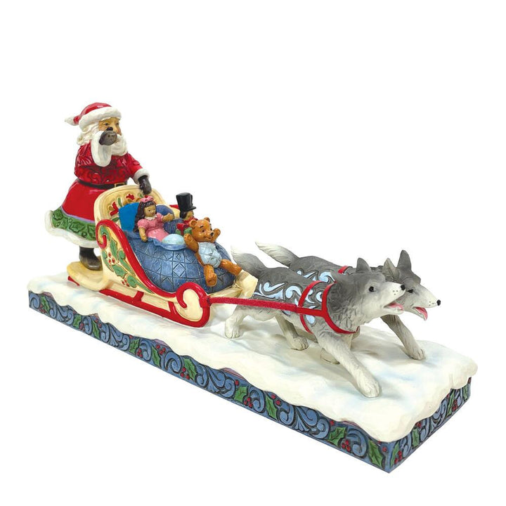 Jim Shore Heartwood Creek: Santa Dog Sledding Figurine sparkle-castle