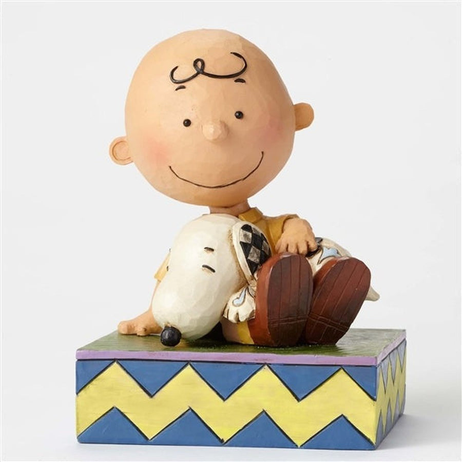 Jim Shore Peanuts: Charlie Brown Holding Snoopy Figurine sparkle-castle