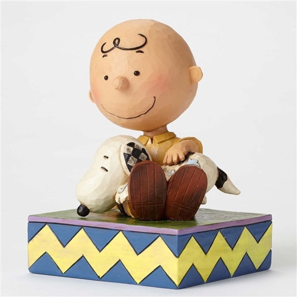 Jim Shore Peanuts: Charlie Brown Holding Snoopy Figurine sparkle-castle