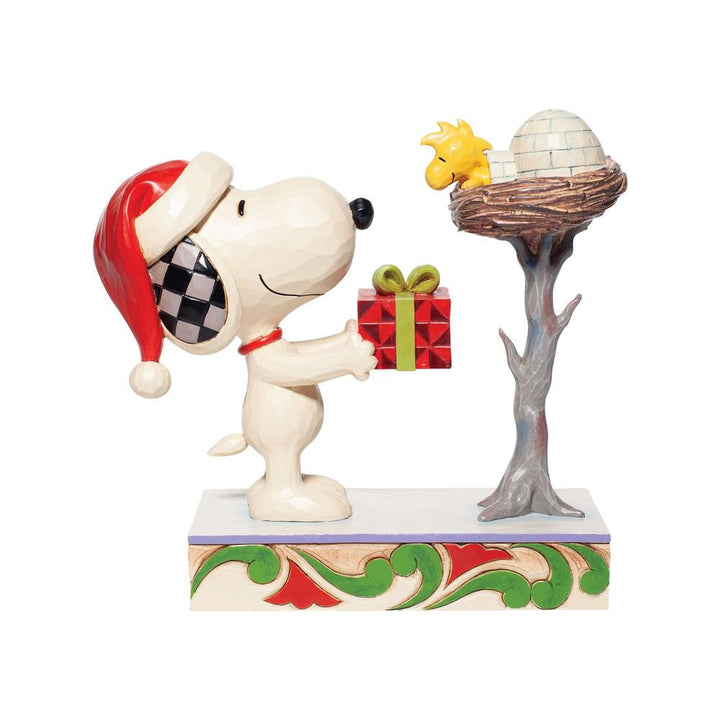 Jim Shore Peanuts: Snoopy giving Woodstock Gift Figurine sparkle-castle