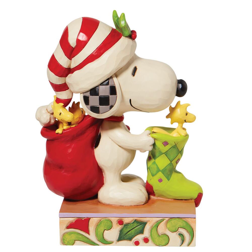 Jim Shore Peanuts: Snoopy Stocking Woodstock Figurine sparkle-castle